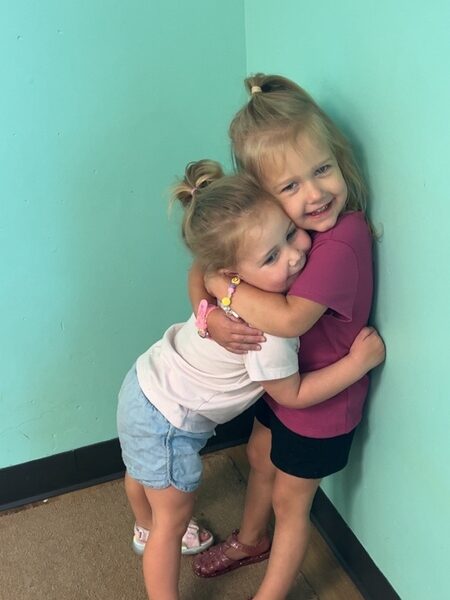 Two Smarr girls hugging