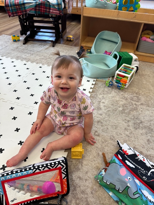 Smarr toddler sitting on mat