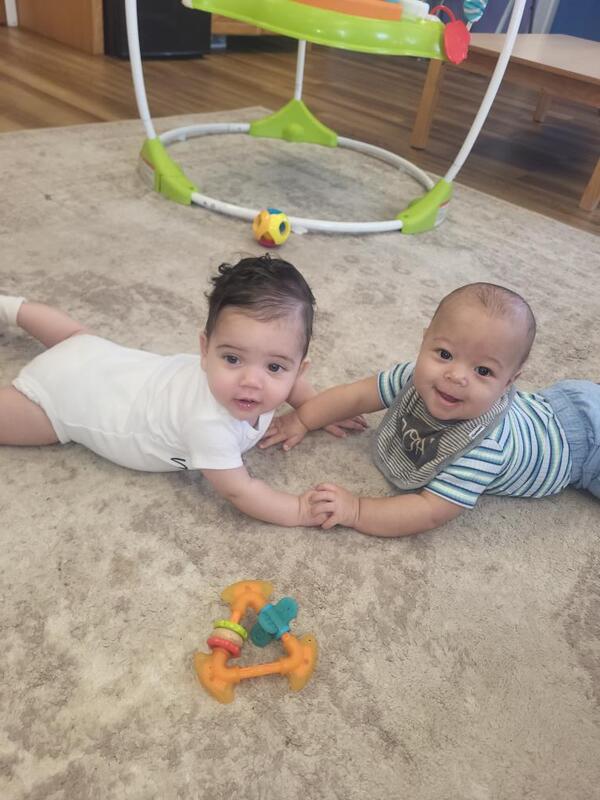 Two Smarr babies holding hands