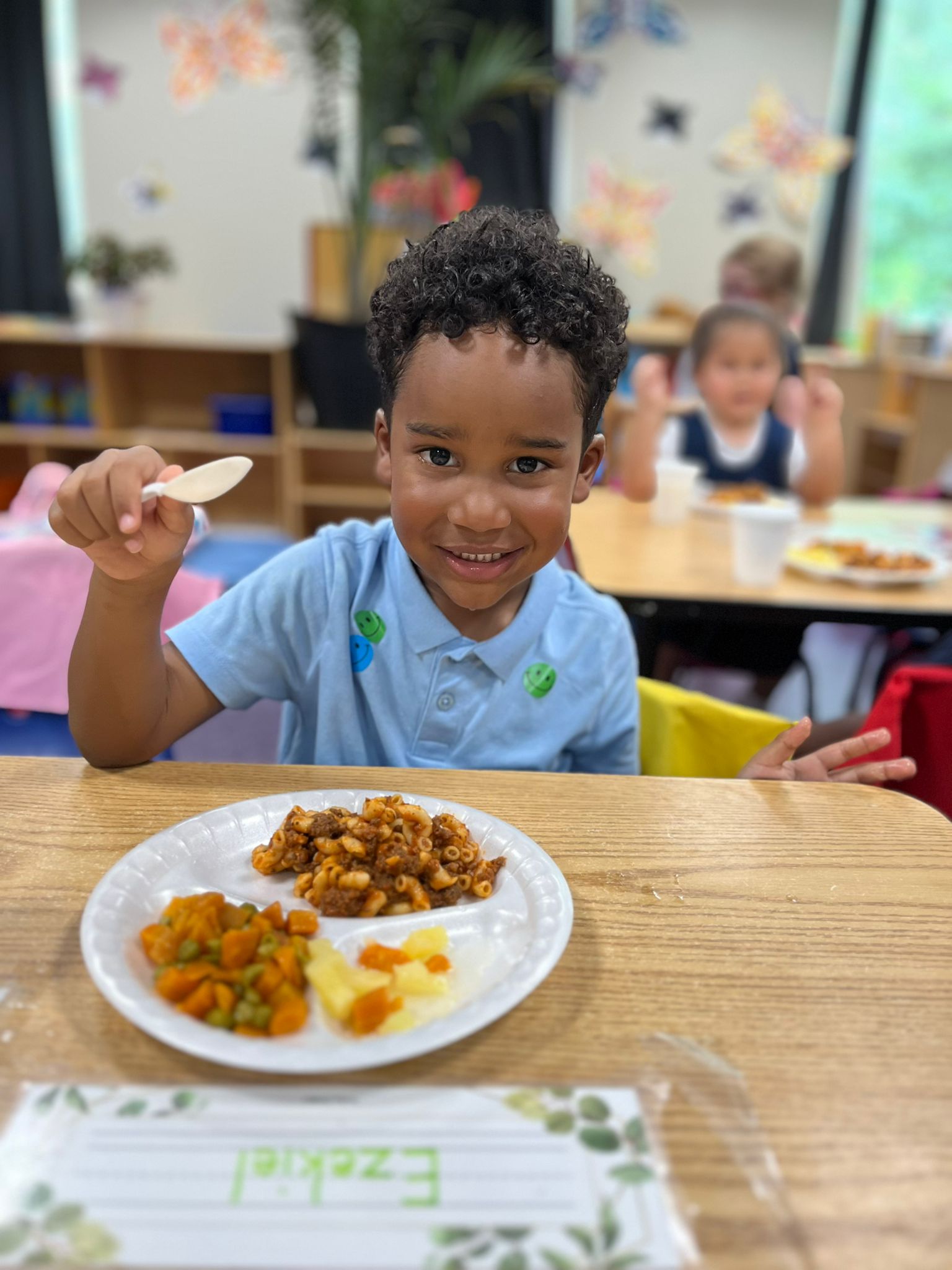 Savannah boy holding spoon for lunch