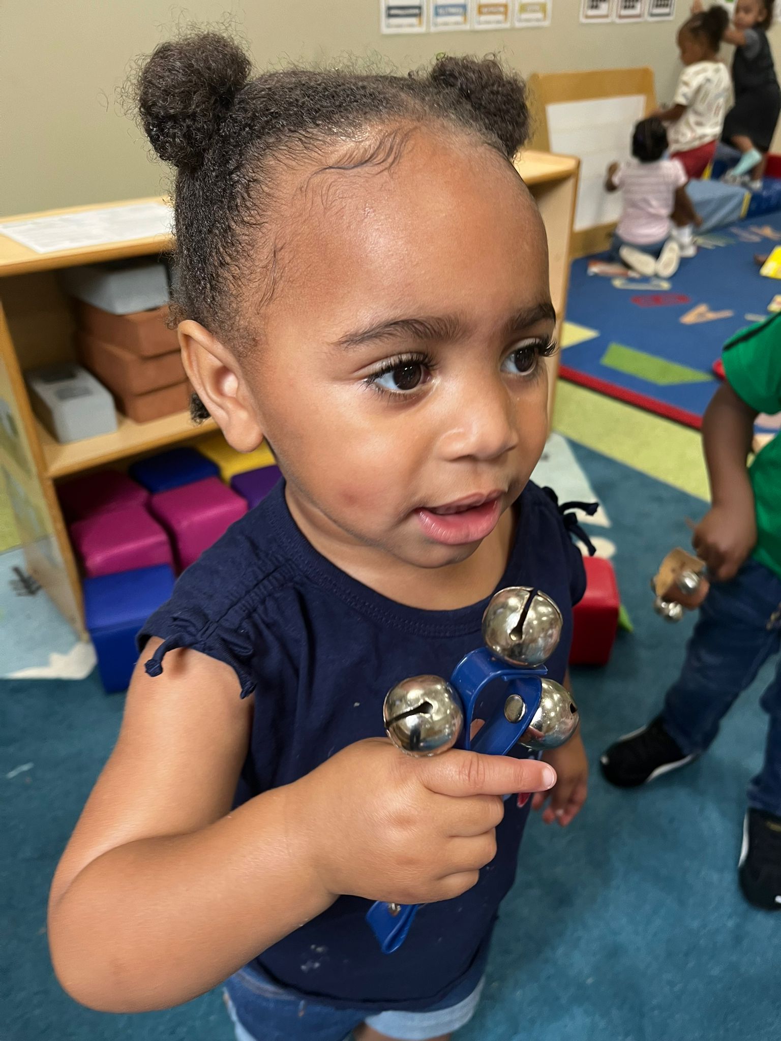 Savannah kid ringing bells
