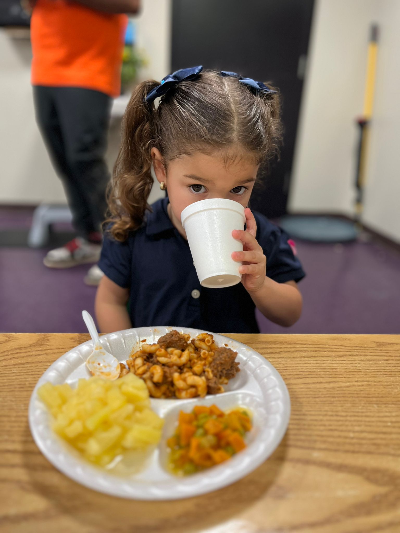 Savannah girl drinking from cup
